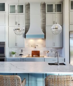 light kitchen with Hoodsly Curved hood in white with custom colored band and extension