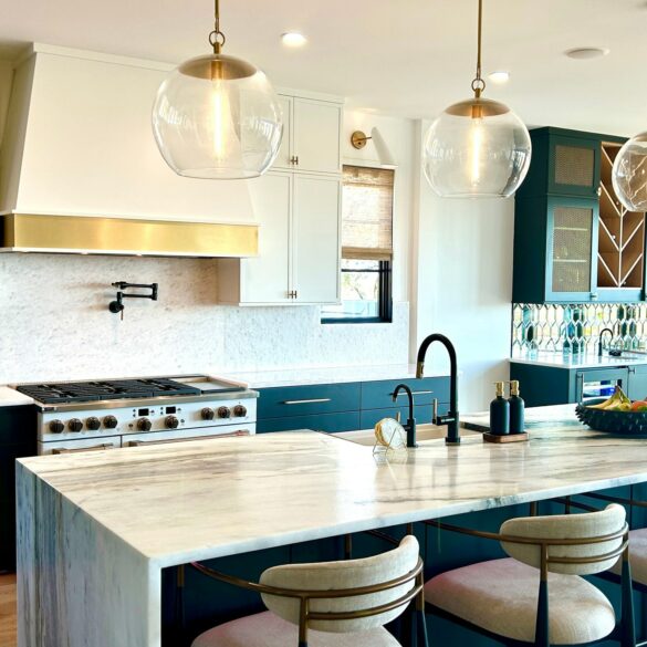 white and navy kitchen with gold accents and pendant lights featuring a white Hoodsly tapered hood with brass apron and flat trim