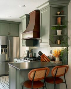 sage kitchen featuring an American Walnut Hoodsly Curved hood and open shelving