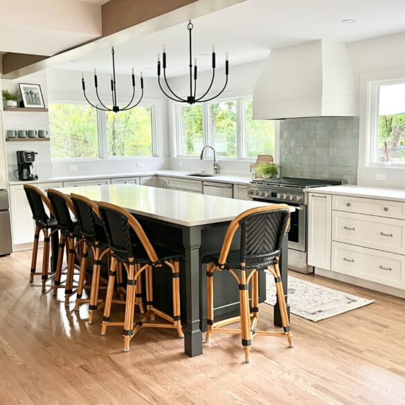 white and black kitchen with warm woods and pendant lights featuring a white Hoodsly bell hood with flat trim