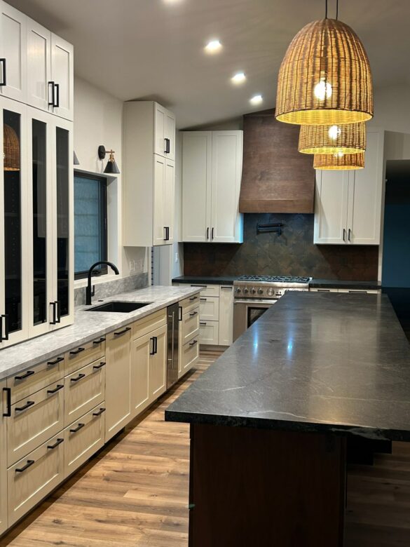 white, black, and stone kitchen with natural accents featuring an American walnut Hoodsly sloped trimless range hood